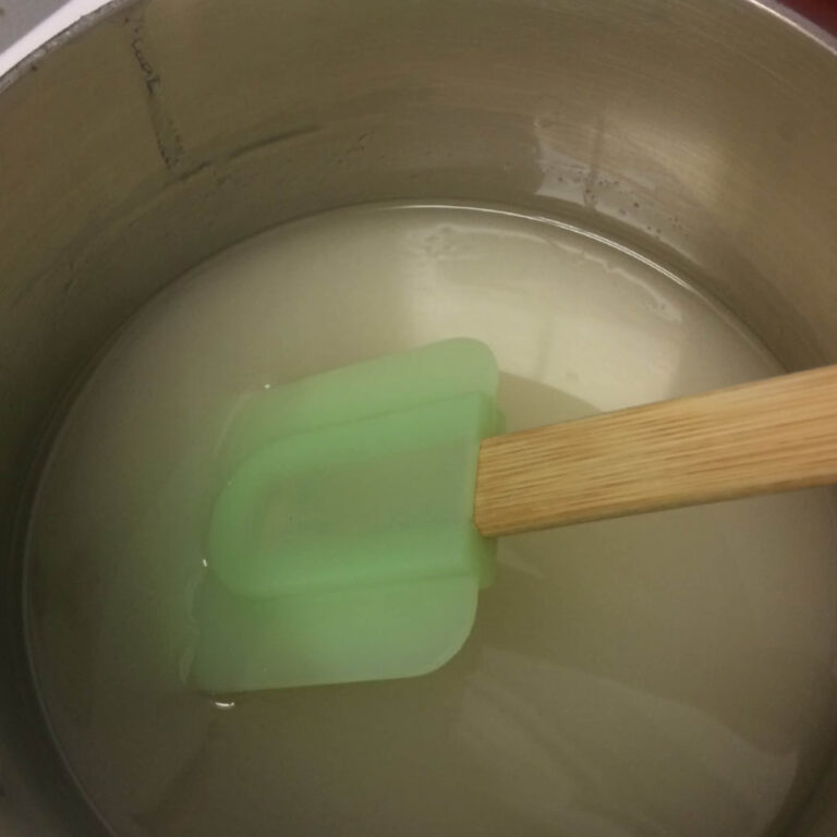 spatula stirring sugar syrup.