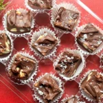 cut dark chocolate macadamia nut fudge in a box.