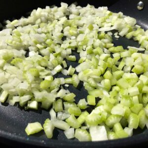 onion and celery cooking in skillet.