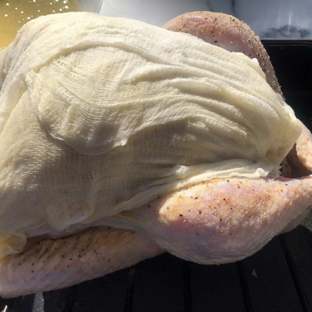 soaked cheesecloth on top of turkey.