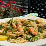 a platter of shrimp lemon dill and orzo salad.