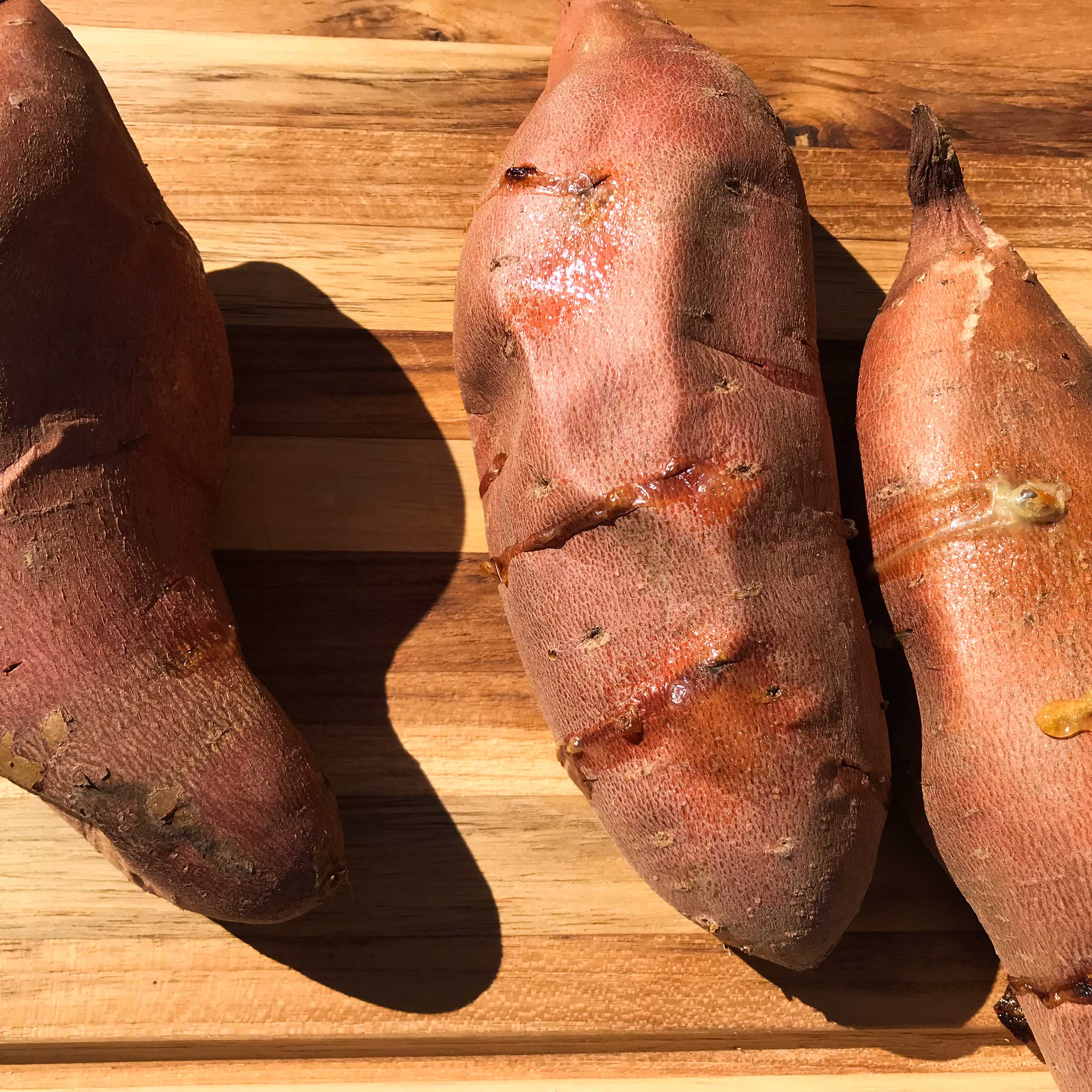 three cooked sweet potatoes.