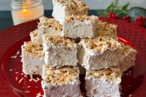 toasted coconut marshmallows piled on a plate.