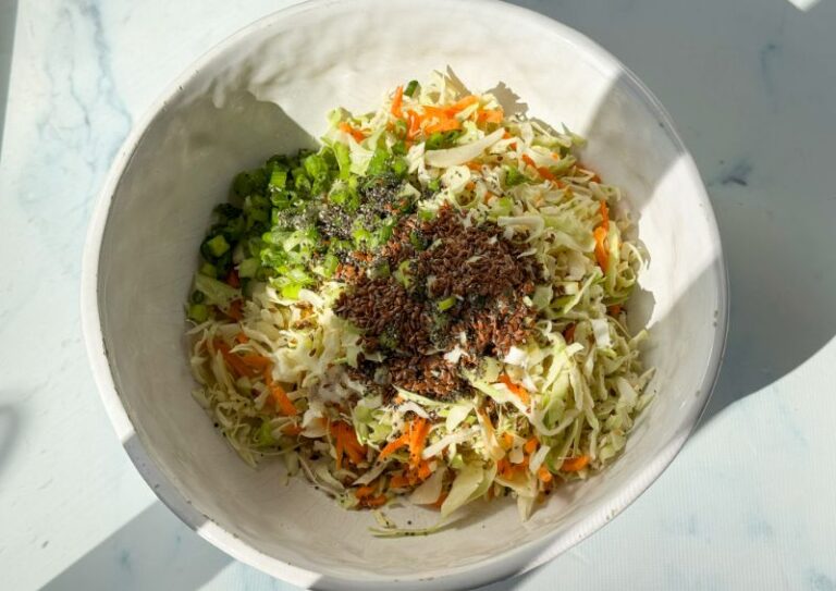 all ingredients for coleslaw in a bowl.