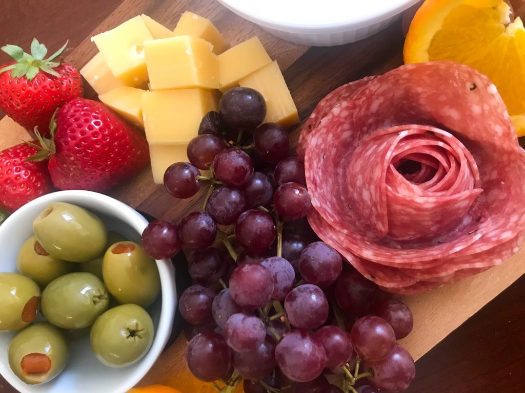 salami rose on cheeseboard