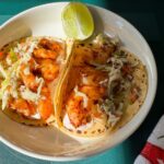 shrimp tacos with chipotle cream and healthy slaw.