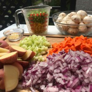 chopped and cut veggies on a board.