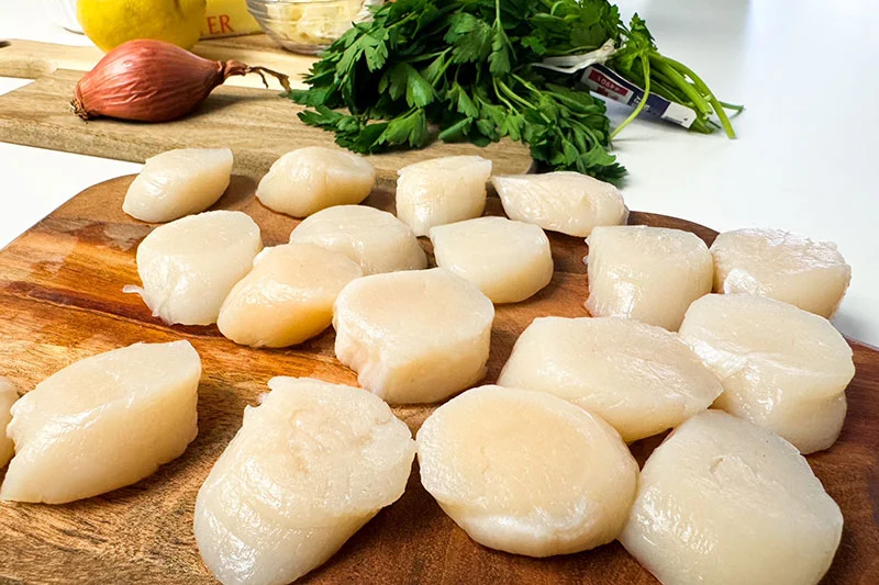 raw scallops with muscles removed.