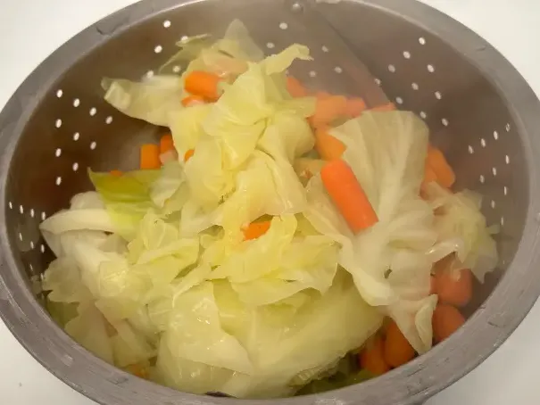 cabbage and carrots draining.