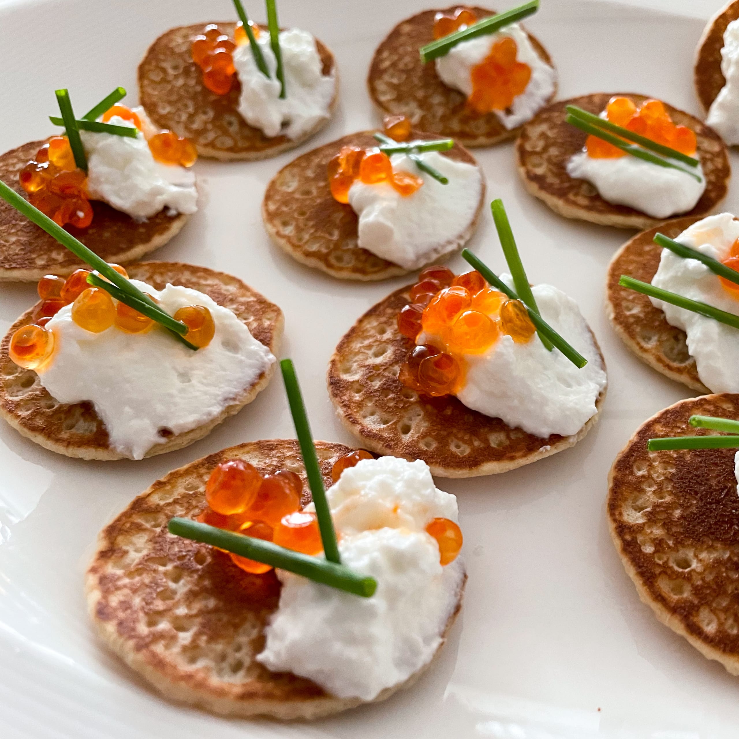 Blini with Fat Free Greek Yogurt, Salmon Roe & Chives | My Curated Tastes