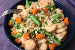 bowl of sweet and spicy shrimp on cauliflower rice.