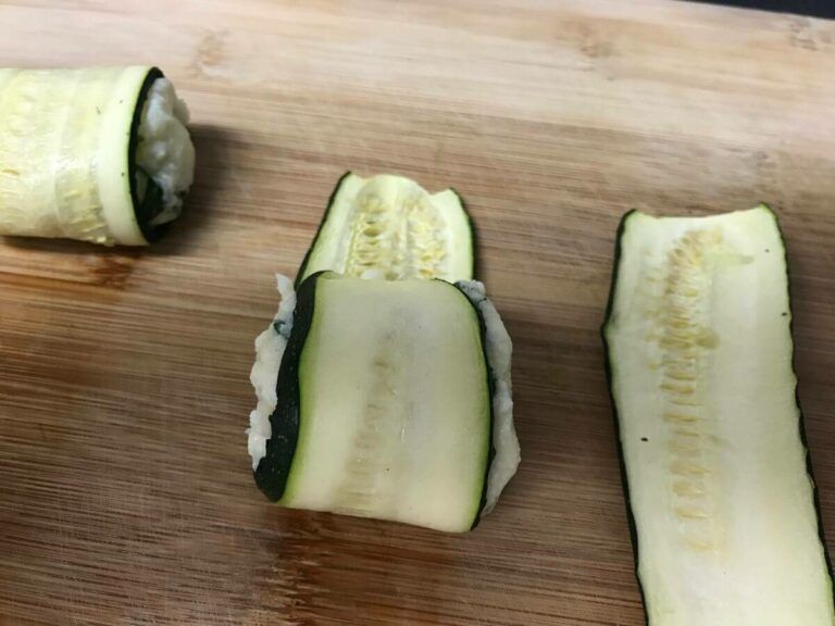 rolling zucchini around filling
