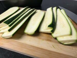 sliced zucchini on a cutting board