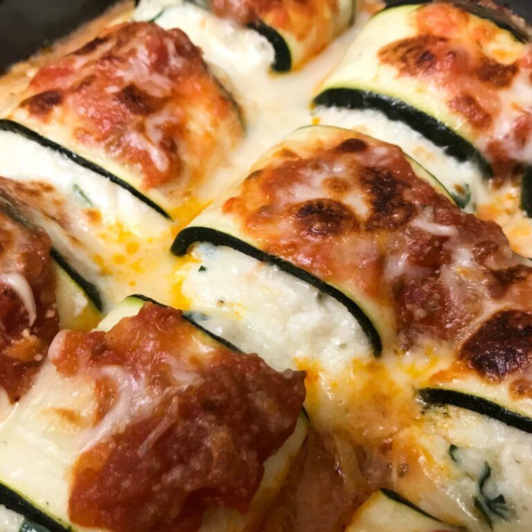 a beauty shot of the finished tray of zucchini roll ups