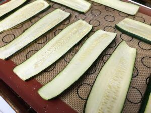 cooked zucchini on a baking sheet