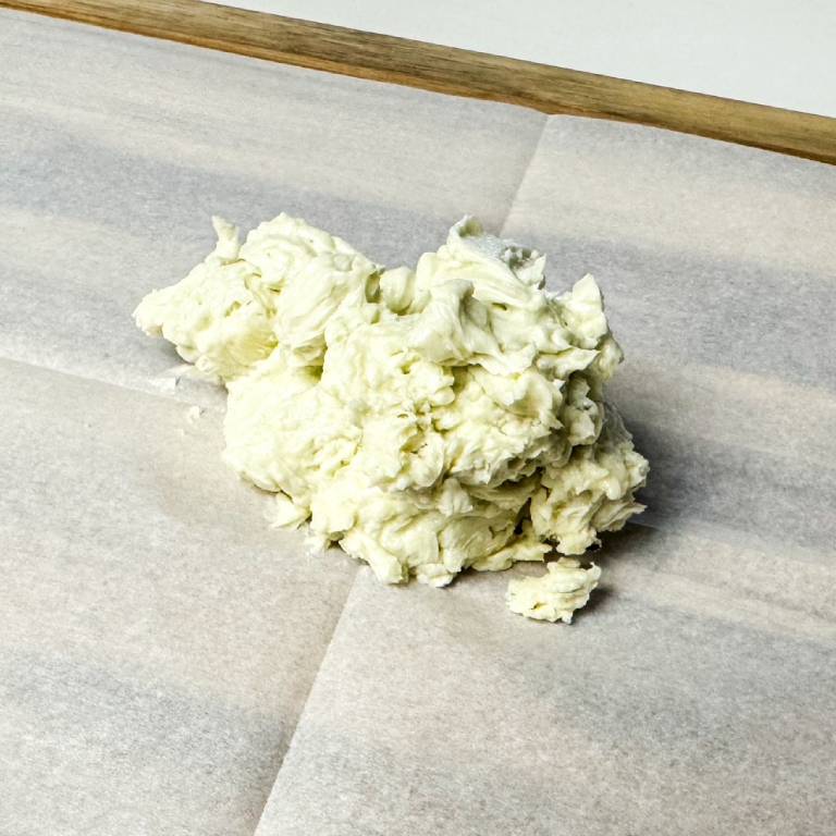 pile of butter on parchment paper.