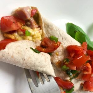 fork in egg and ham wrap