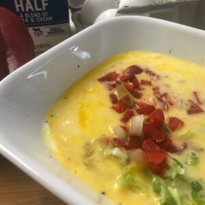 mixed eggs and veggies in a bowl