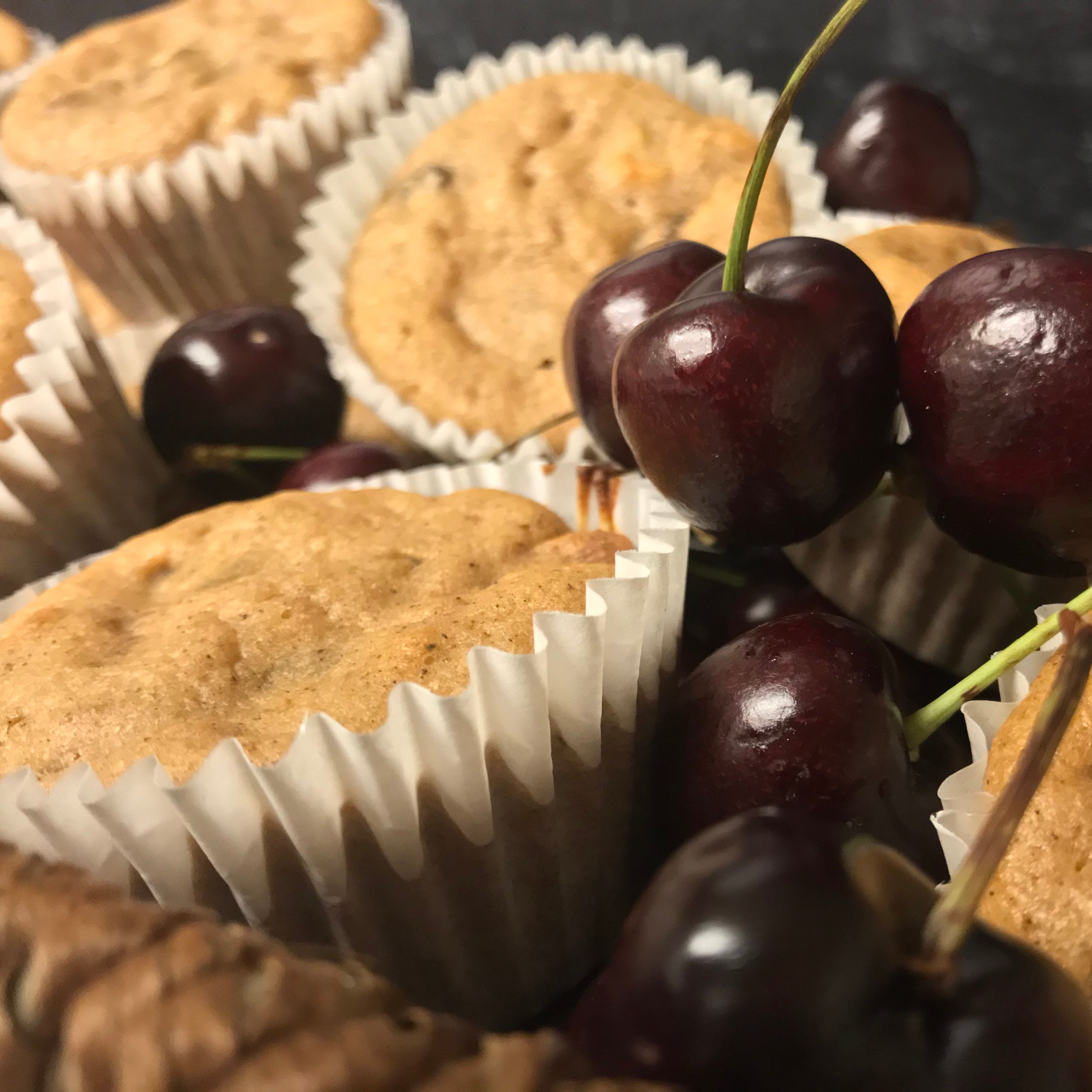 Muffins and cherries in a basket