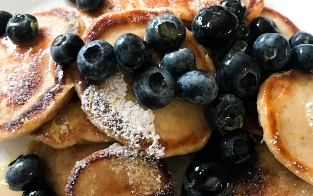 Mini lemon pancakes with blueberry syrup