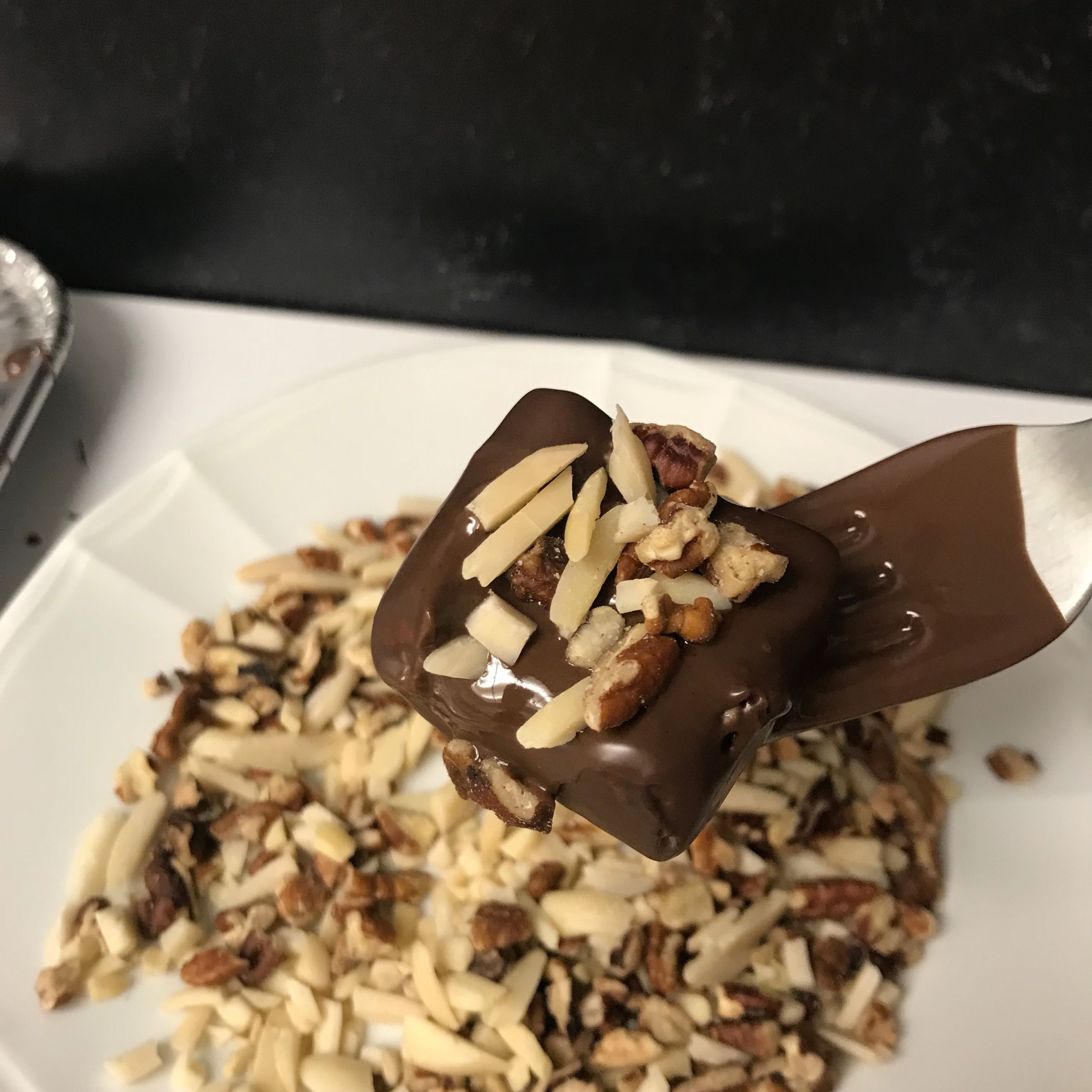 beauty shot of square in chocolate and nuts