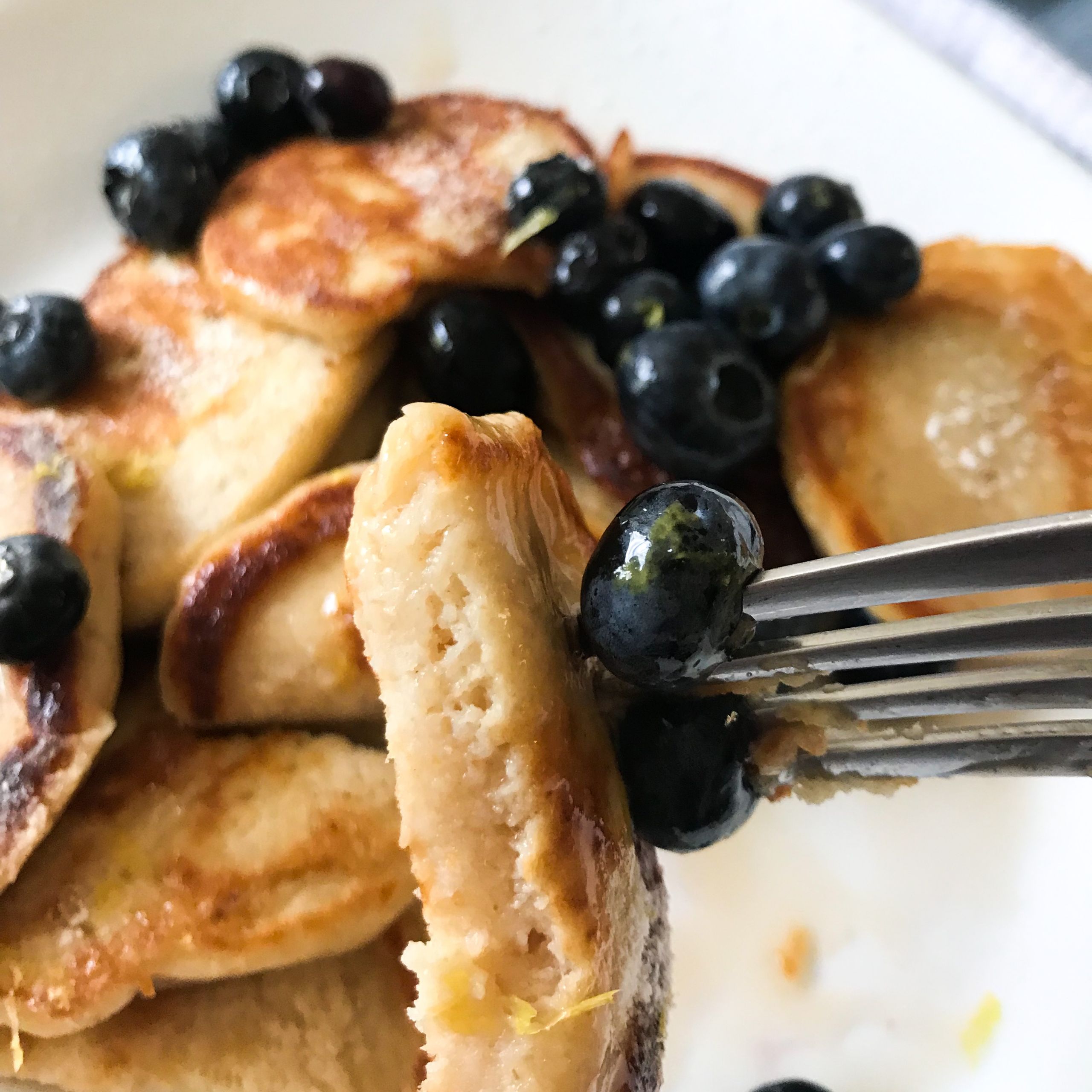 forkful of pancakes and berries