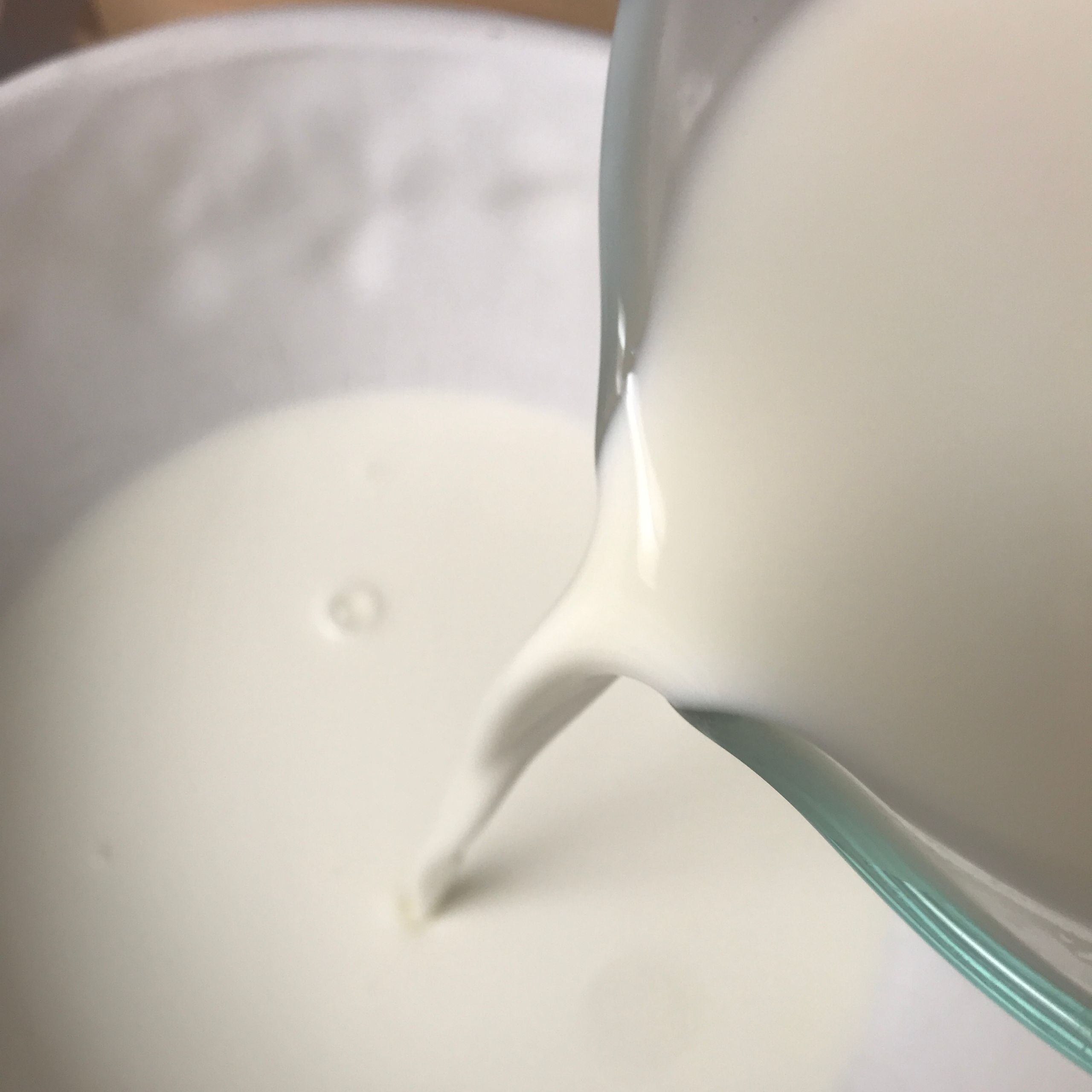 Pouring cream into bowl