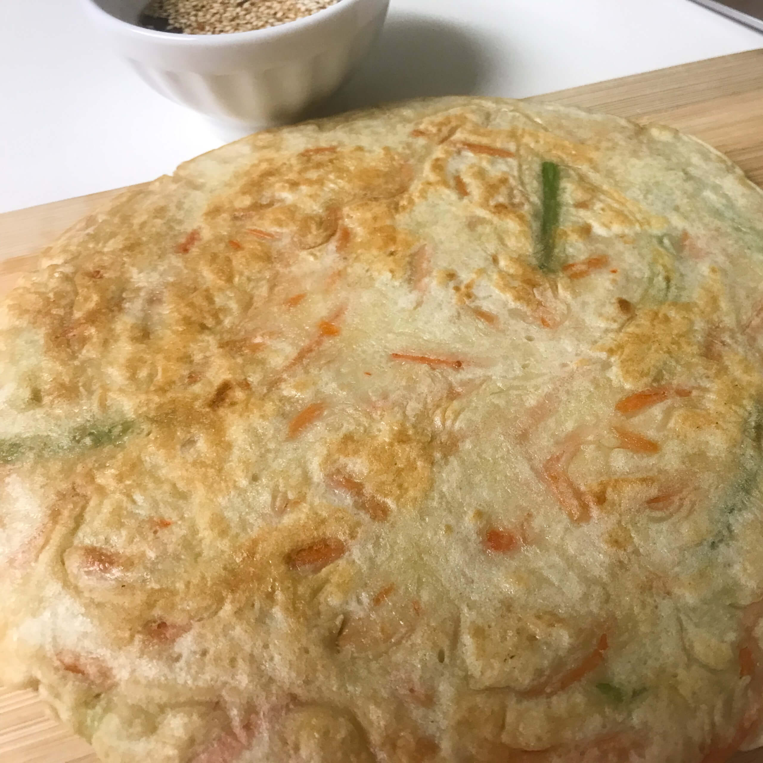 cooked korean pancake on cutting board