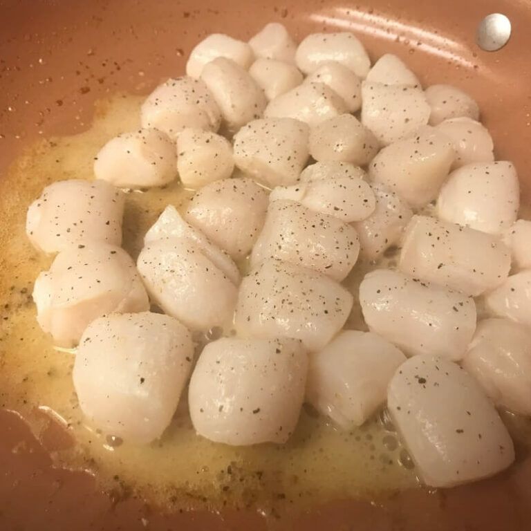 scallops cooking in skillet