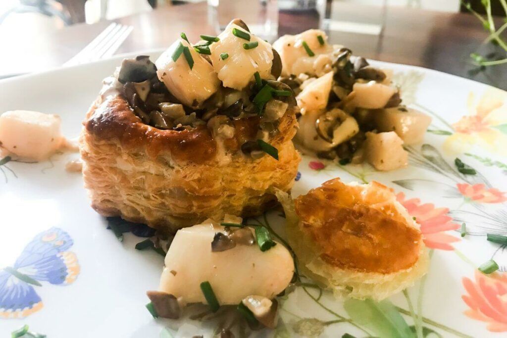 Scallops And Mushrooms In Puff Pastry With A Bourbon Cream Sauce on a plate