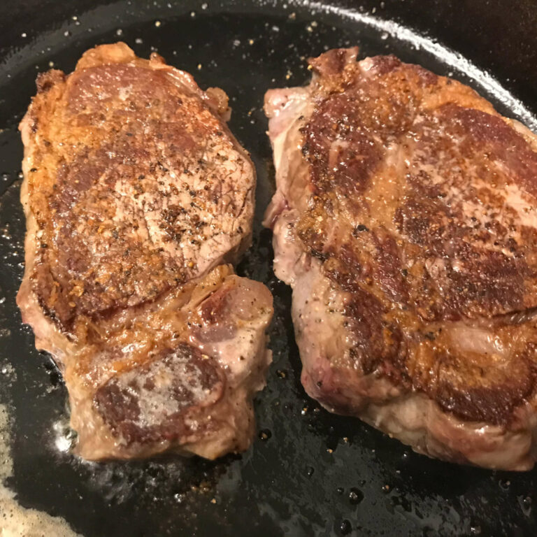 steak cooked in skillet.