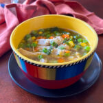 chicken and rice soup in a bowl.