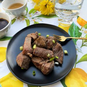 Steak bites on a plate.