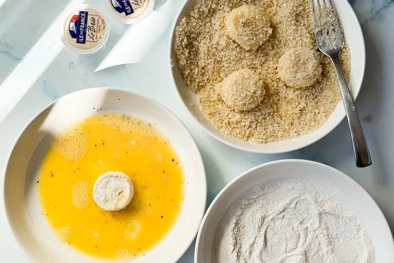 baby brie in a breading station.