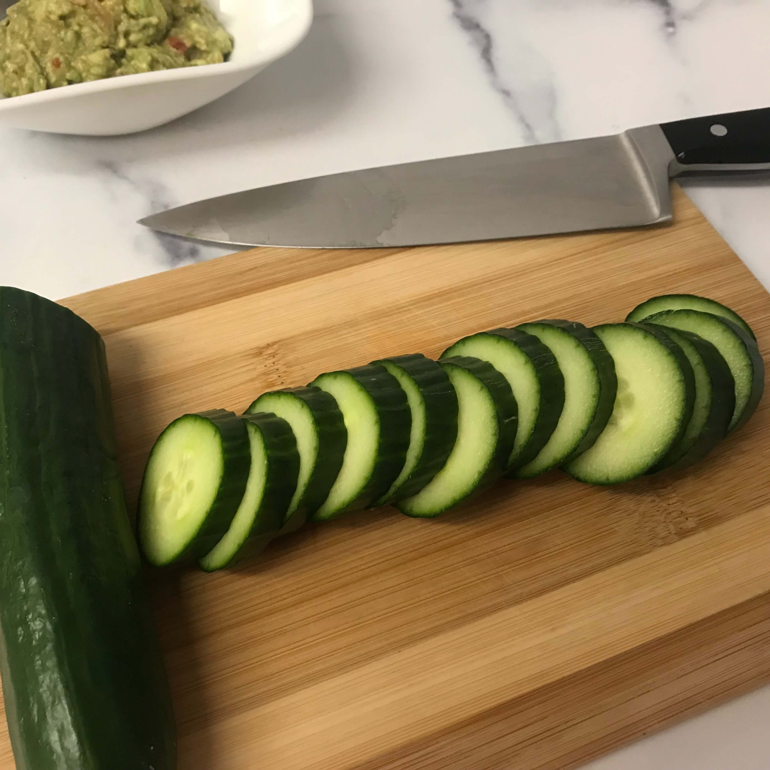 sliced cucumber on board | my curated tastes