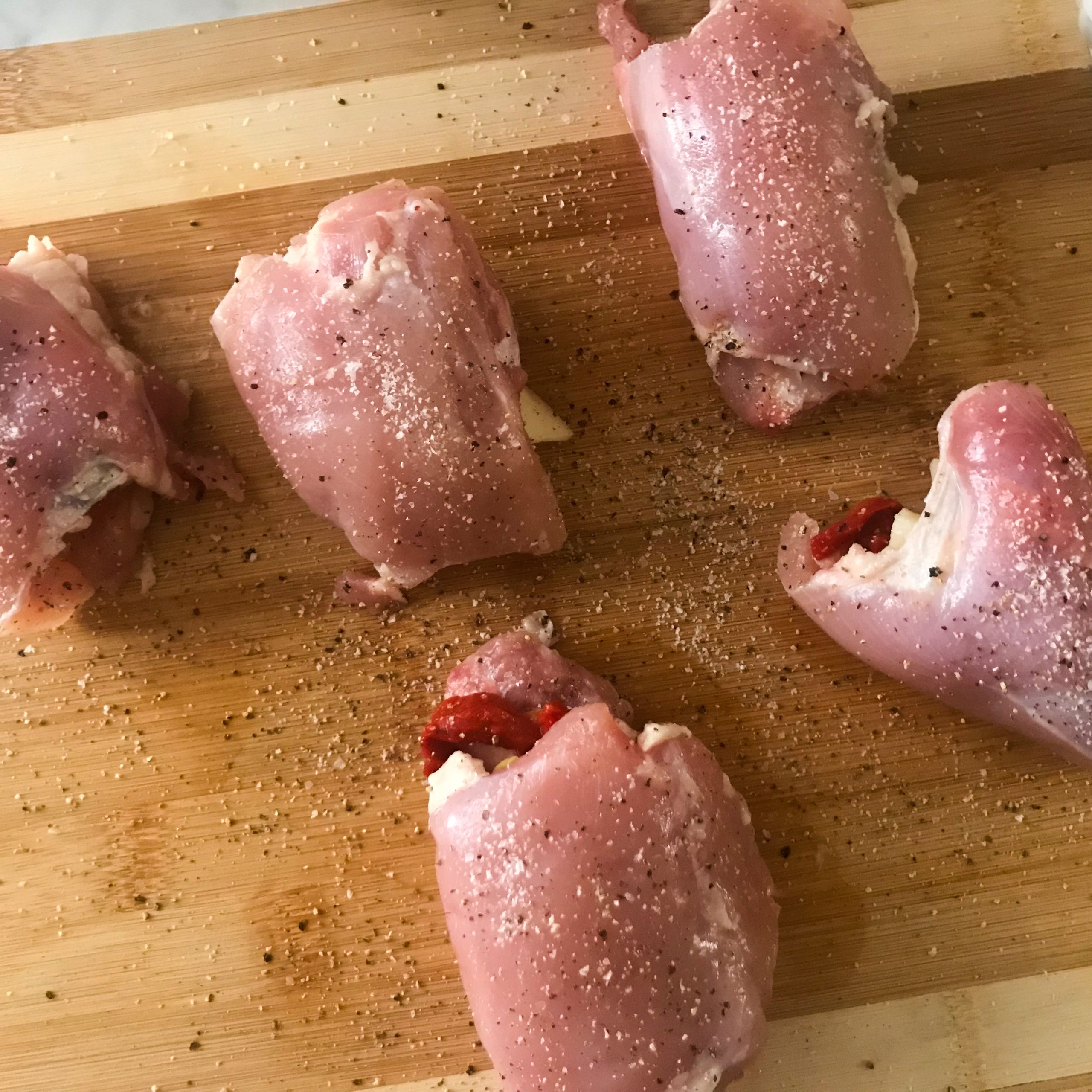 Sheet Pan stuffed chicken thighs rolled up | My Curated Tastes