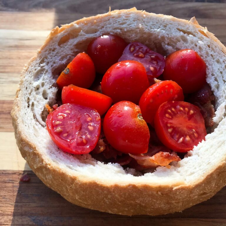 tomatoes and bacon in bread bowl.