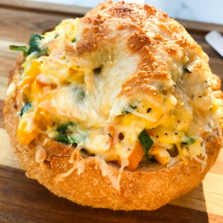toasted and finished scrambled egg bread bowl.