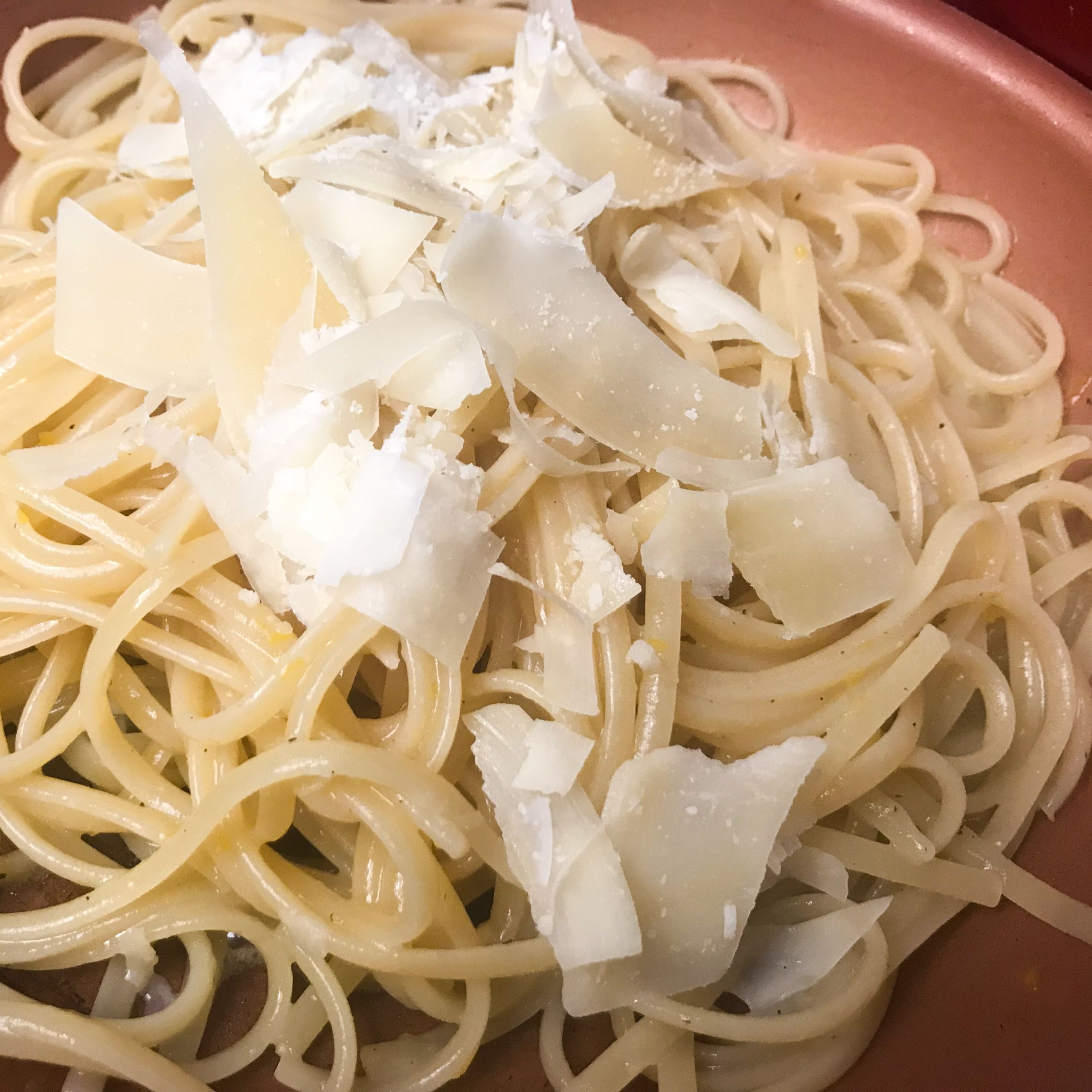 parmesan on linguini in skillet | my curated tastes