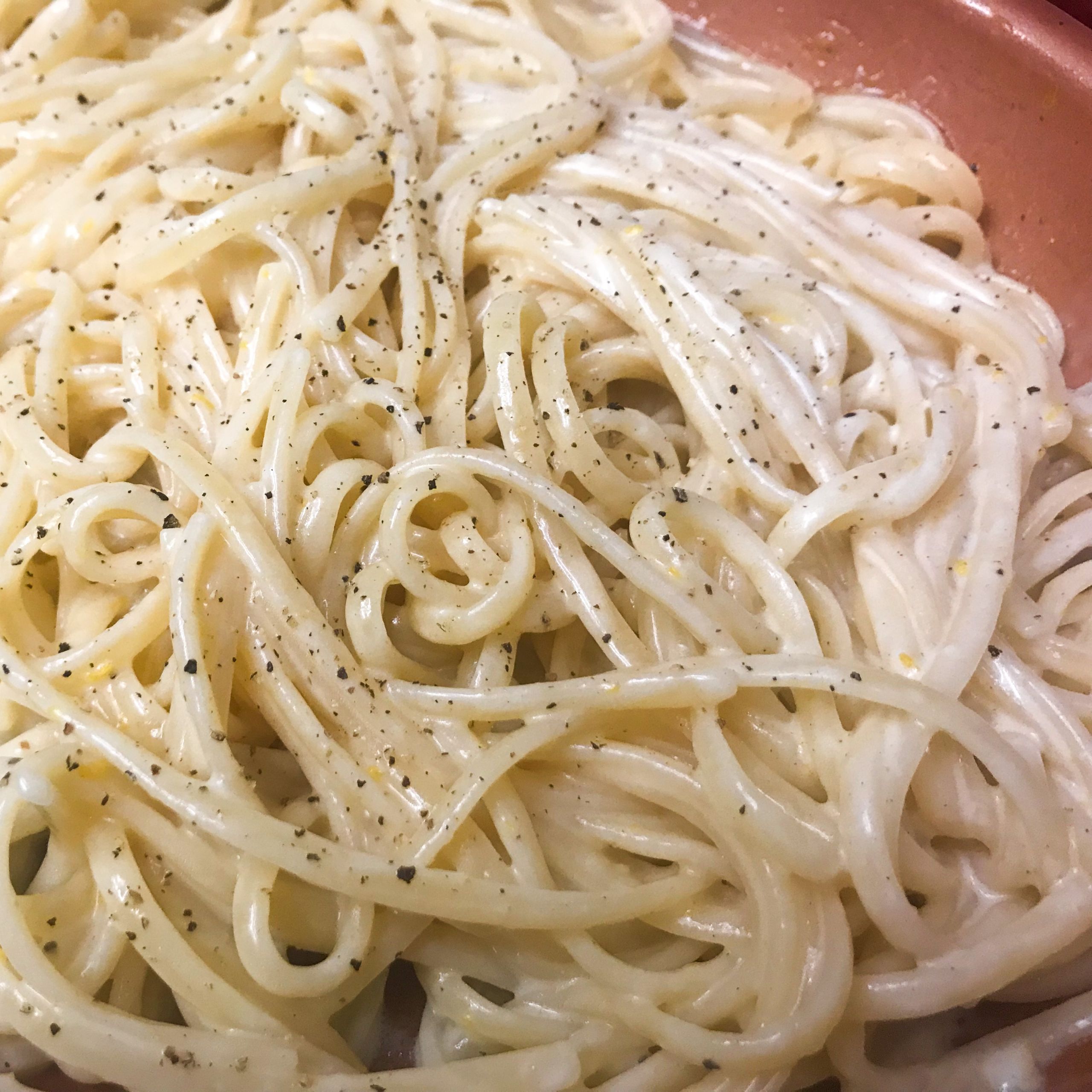 linguini all mixed in pan with salt ans pepper | my curated tastes
