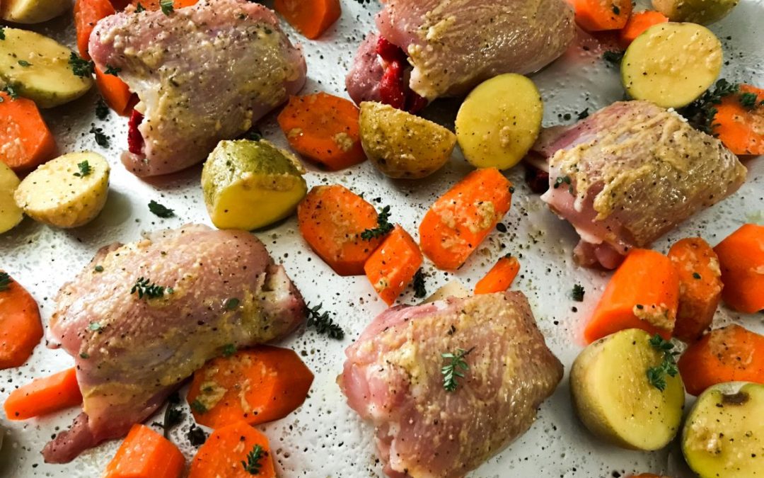 Sheet Pan Stuffed Chicken Thighs with carrots and new potatoes | My Curated Tastes