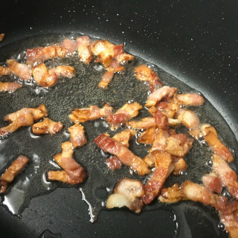 cooked bacon in skillet.