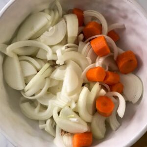 bowl of chopped onions and carrots.