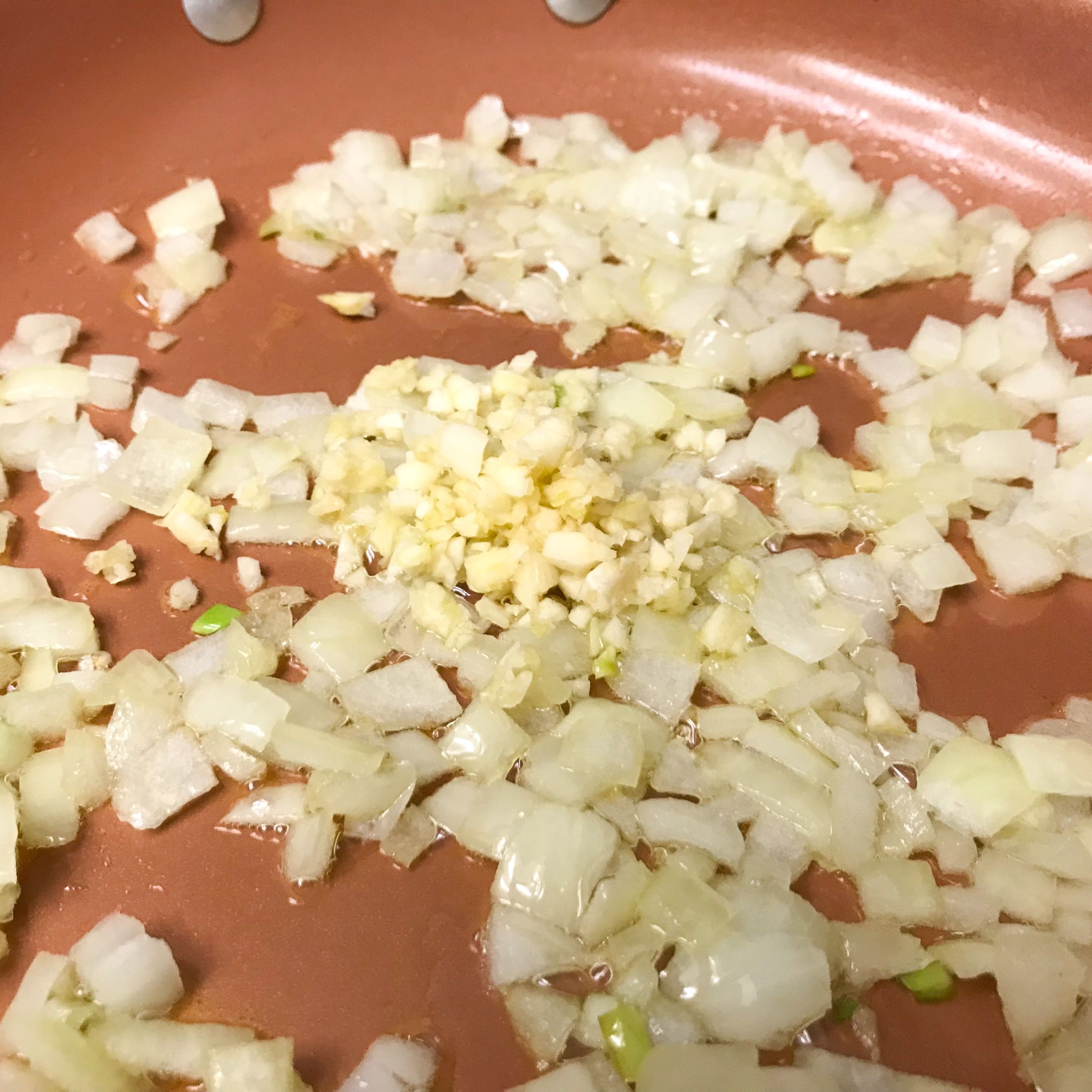 onion and garlic in skillet | my curated tastes