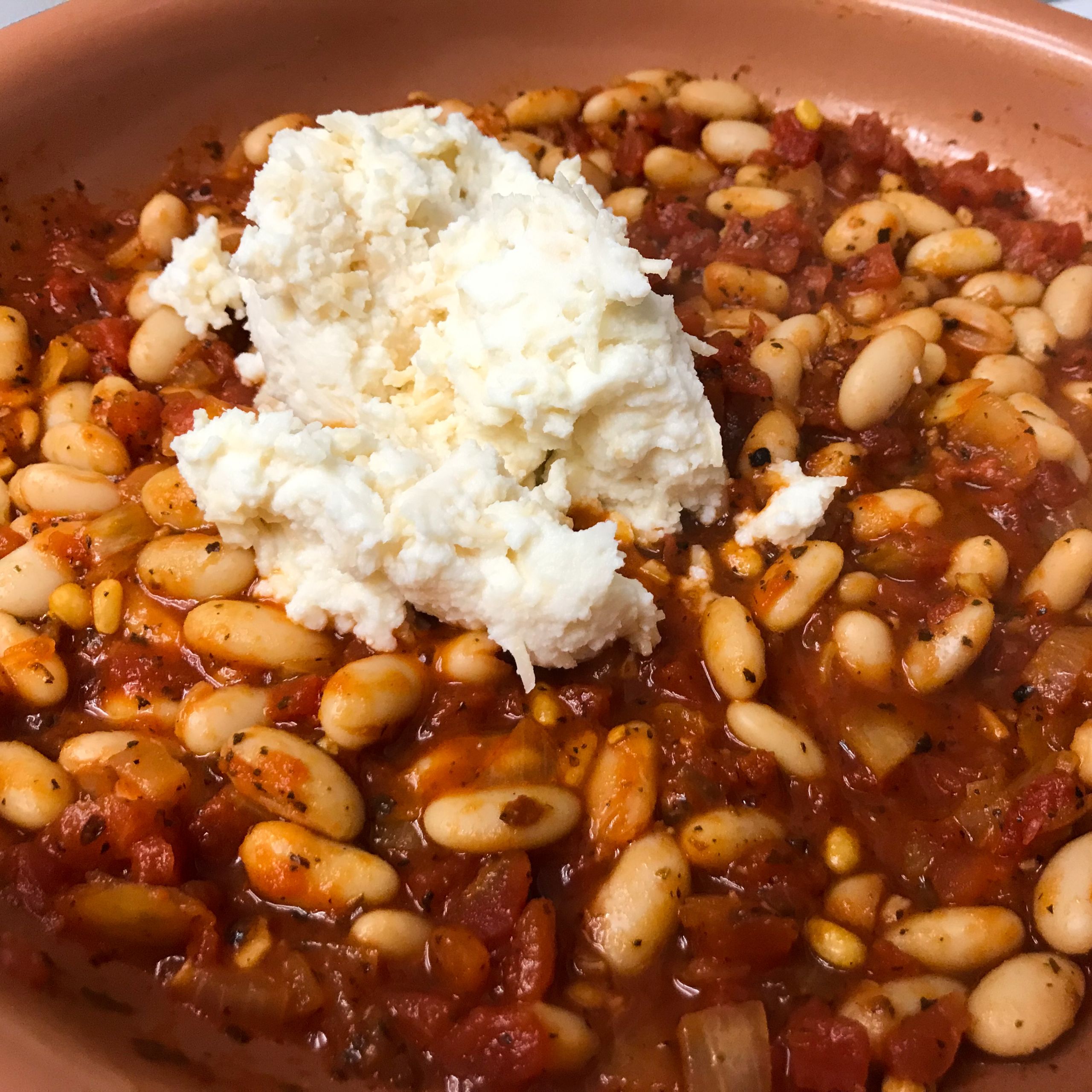 cheese added to tomato and beans mix | my curated tastes
