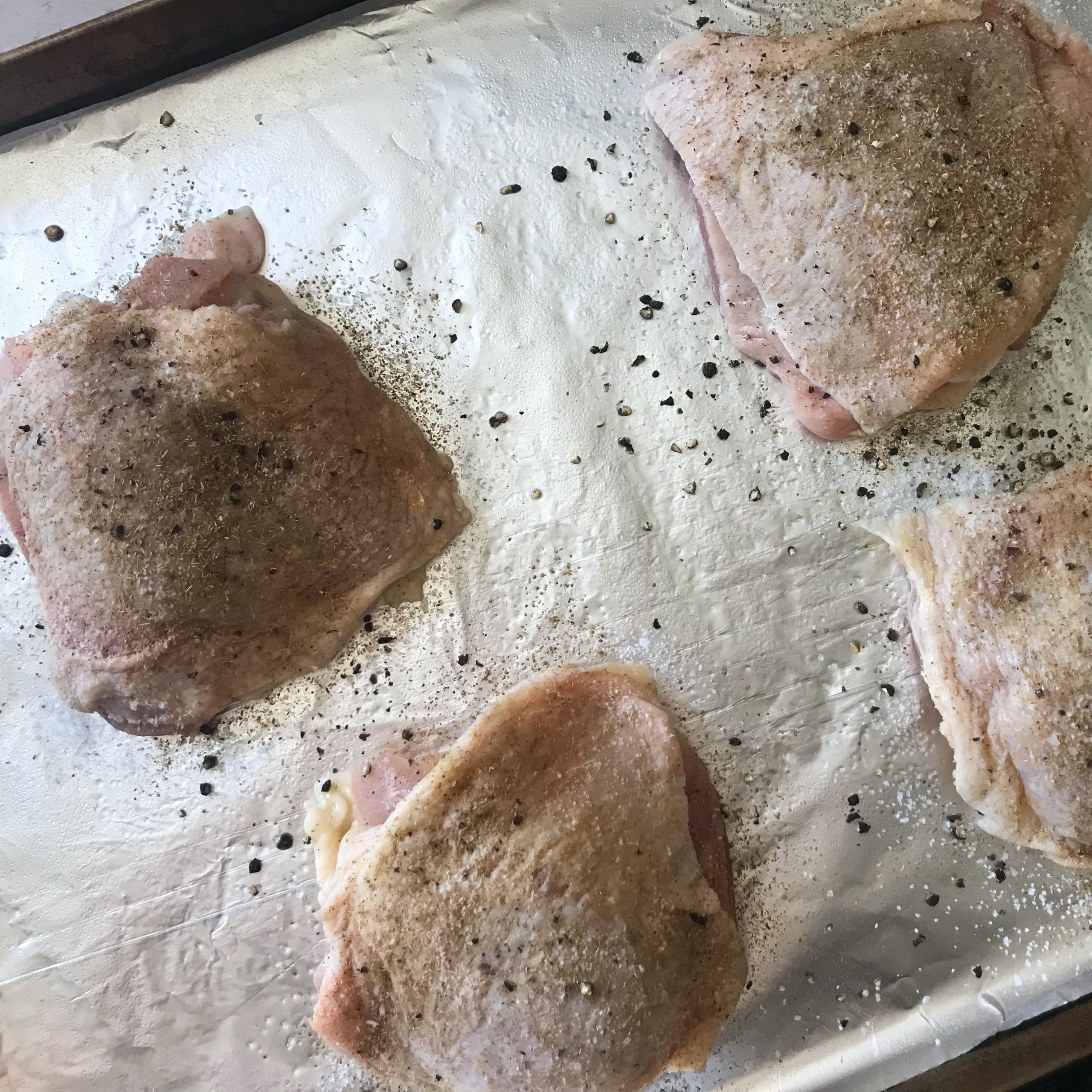 raw chicken on sheetpan | my curated tastes