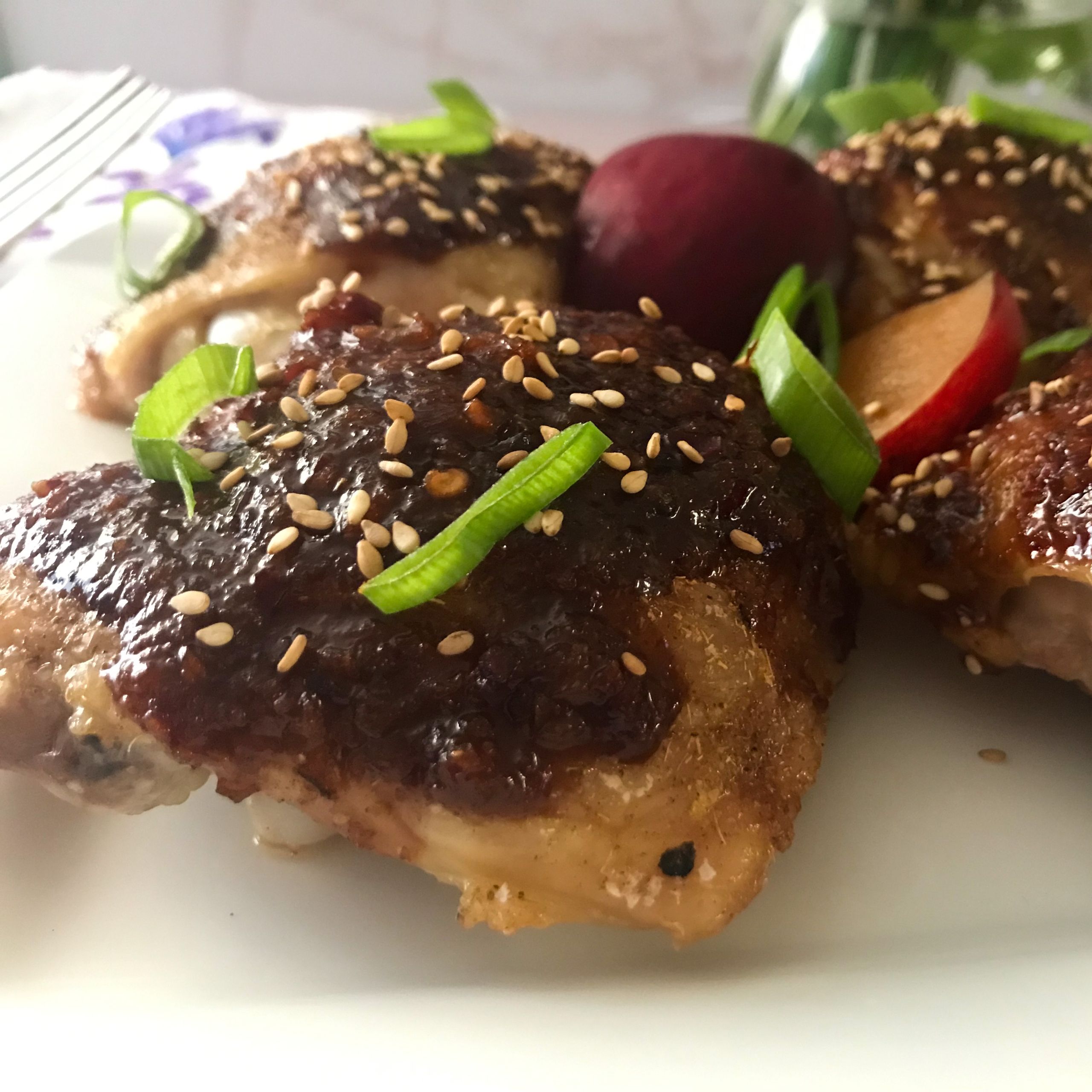 plum glazed chicken on plate | my curated tastes