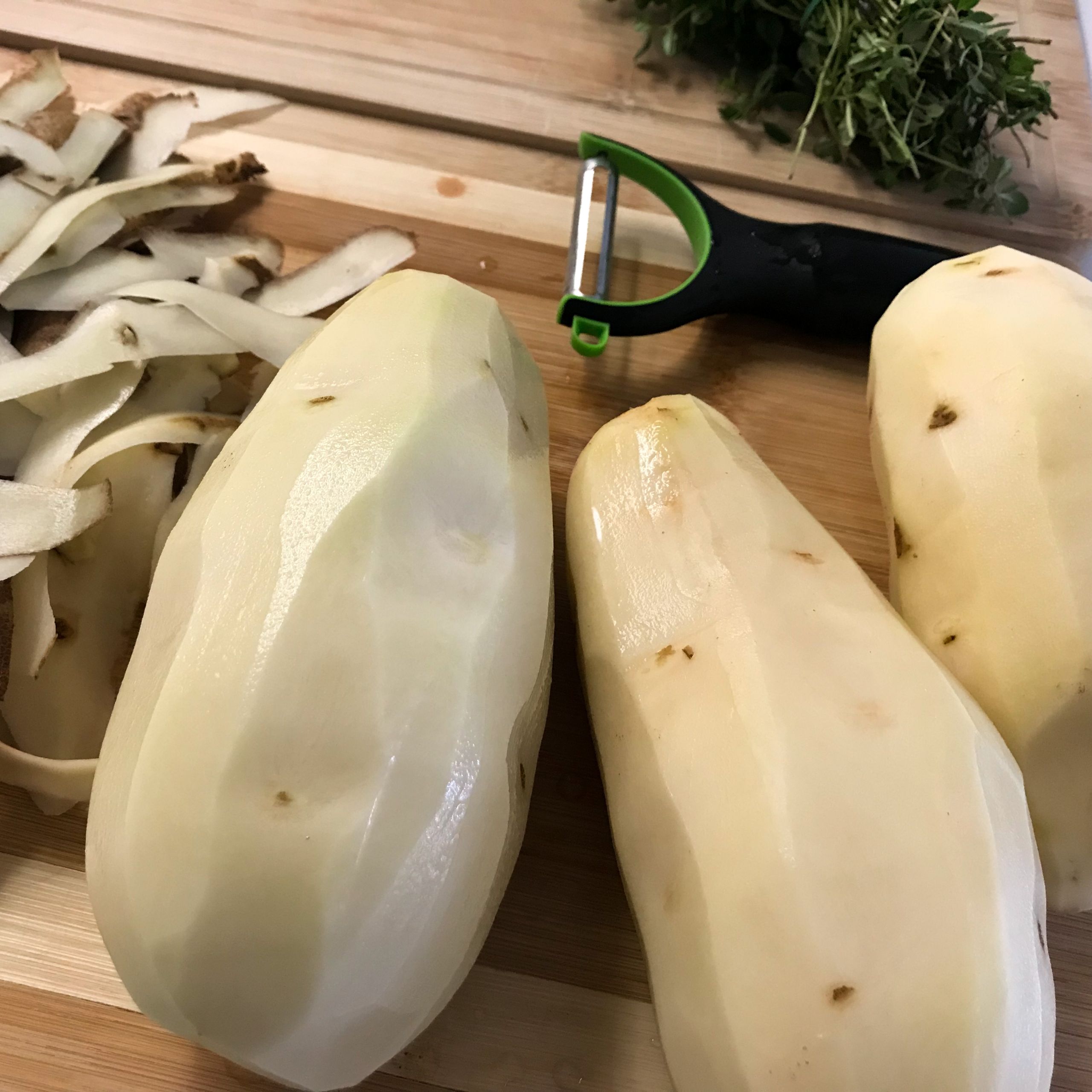peeled potatoes on a board | my curated tastes