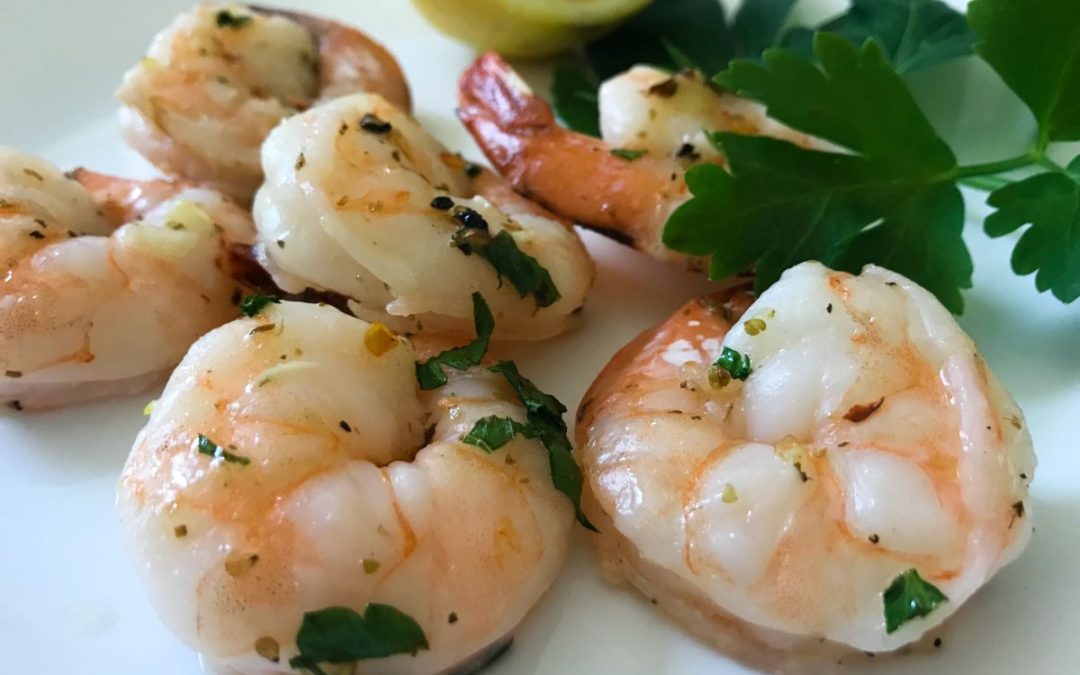 Grilled scampi shrimp on a plate with lemon | my curated tastes