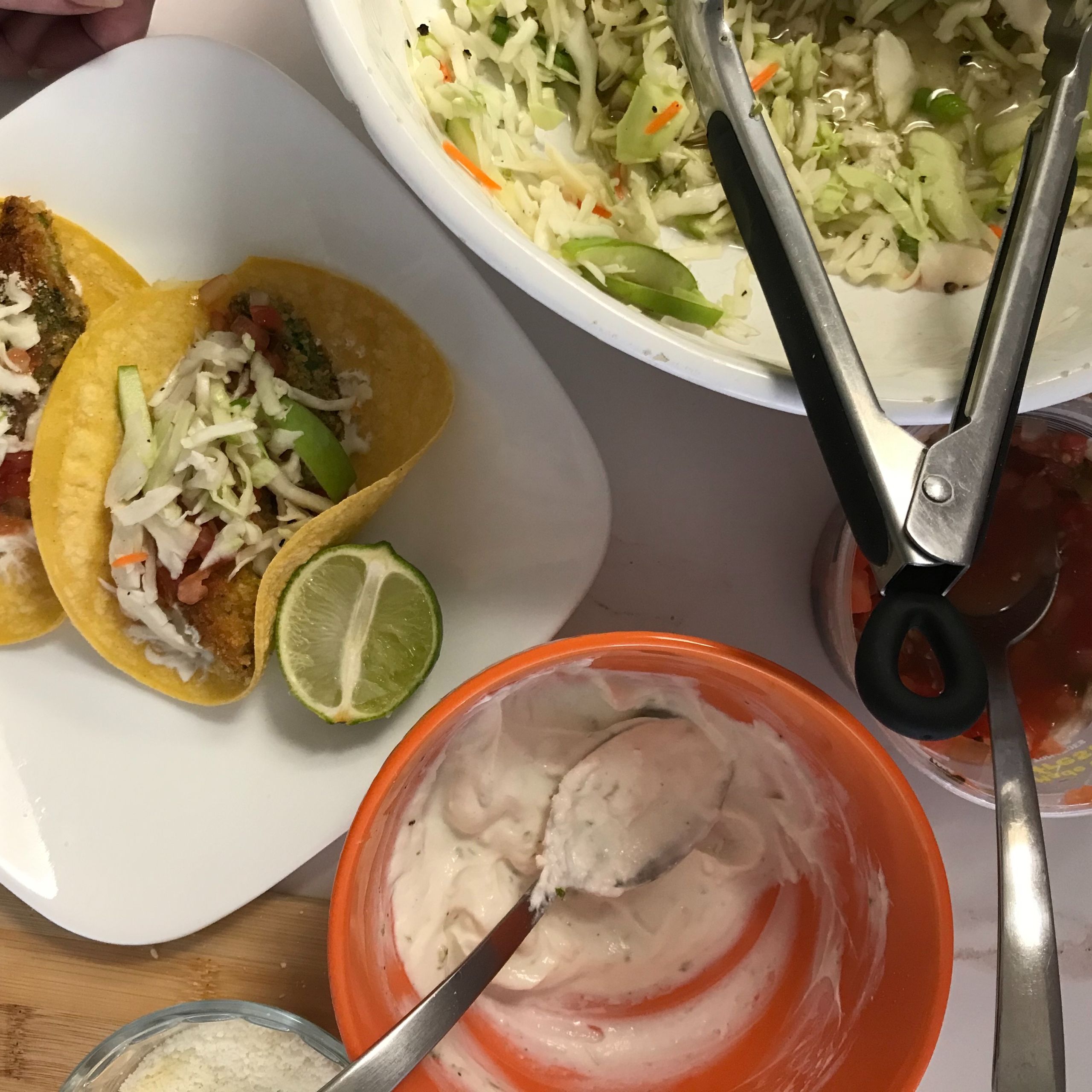 finished tacos on a plate with toppings | my curated tastes